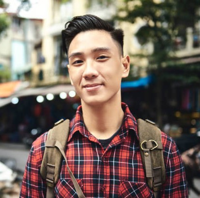 Portrait of young tourist with backpack in the city Portrait of young tourist with backpack in the city
